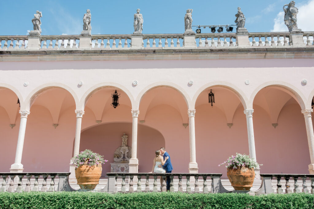 A couple at the ringling museum at their engagement session celebrating their love.