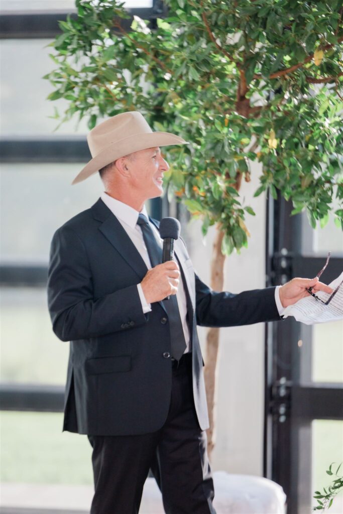 Father of the bride speech captured by Florida wedding photographer and videographer.