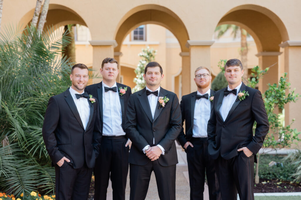 A portrait of the groomsmen the Ritz Carlton Orlando captured by Angelika Krug Photo & Film a Florida wedding photographer.