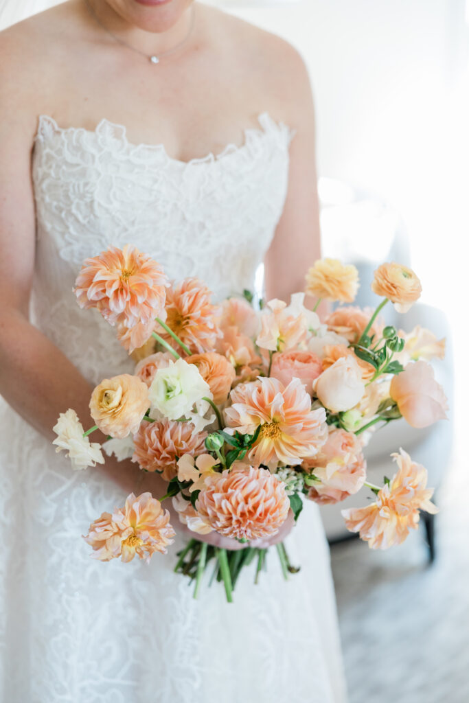 Wedding at the Ritz Carlton Orlando showing a bouquet of flowers created by The Floral Way.