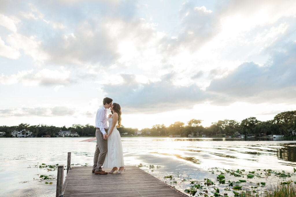 Engagement photos lakeside at  Rollins College with the sunset coming down captured by Orlando wedding photographer, Angelika Krug Photo & Film. 
