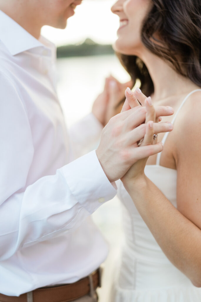 Engagement photos lakeside at  Rollins College with the sunset coming down captured by Orlando wedding photographer, Angelika Krug Photo & Film. 