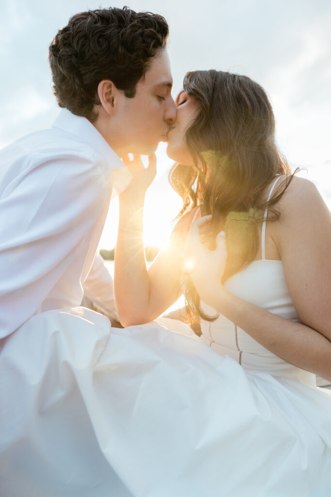 Engagement photos lakeside at  Rollins College with the sunset coming down captured by Florida wedding photographer, Angelika Krug Photo & Film. 