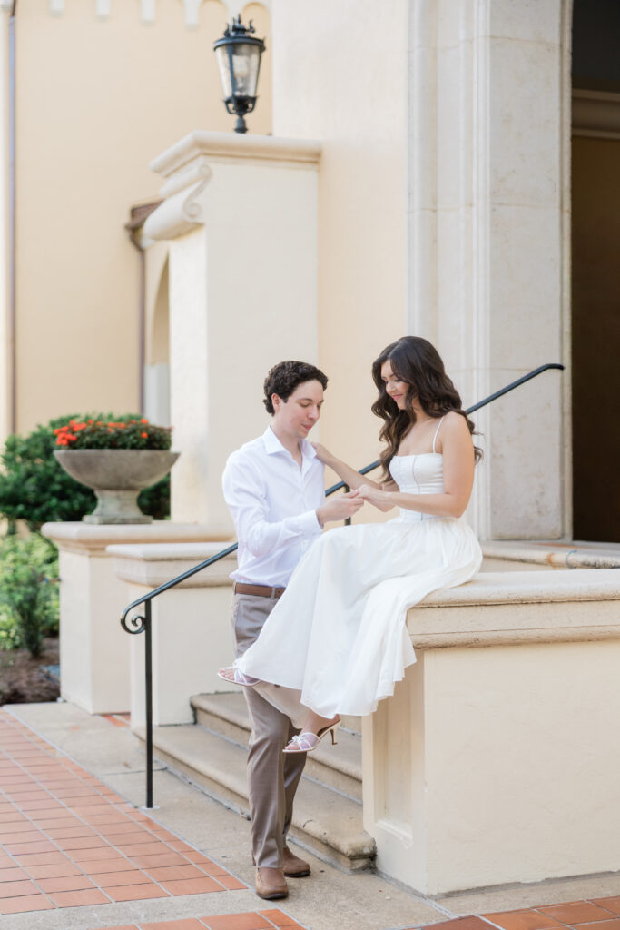Engagement photos in font of the library at Rollins College captured by Orlando wedding photographer, Angelika Krug Photo & Film. 