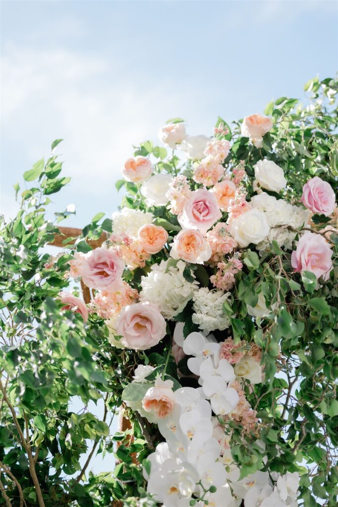 Ceremony florals by Petal Productions at the Loews Coral Gables wedding photographed by Angelika Krug Photo & Film a South Florida wedding photographer.