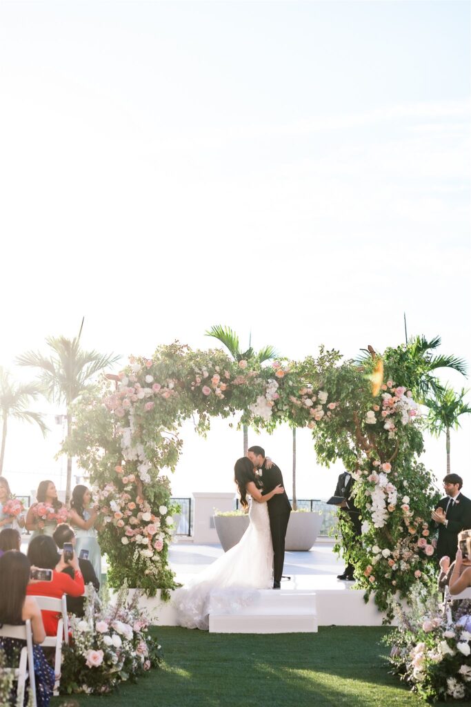 Ceremony florals by Petal Productions at the Loews Coral Gables wedding photographed by Angelika Krug Photo & Film a South Florida wedding photographer.
