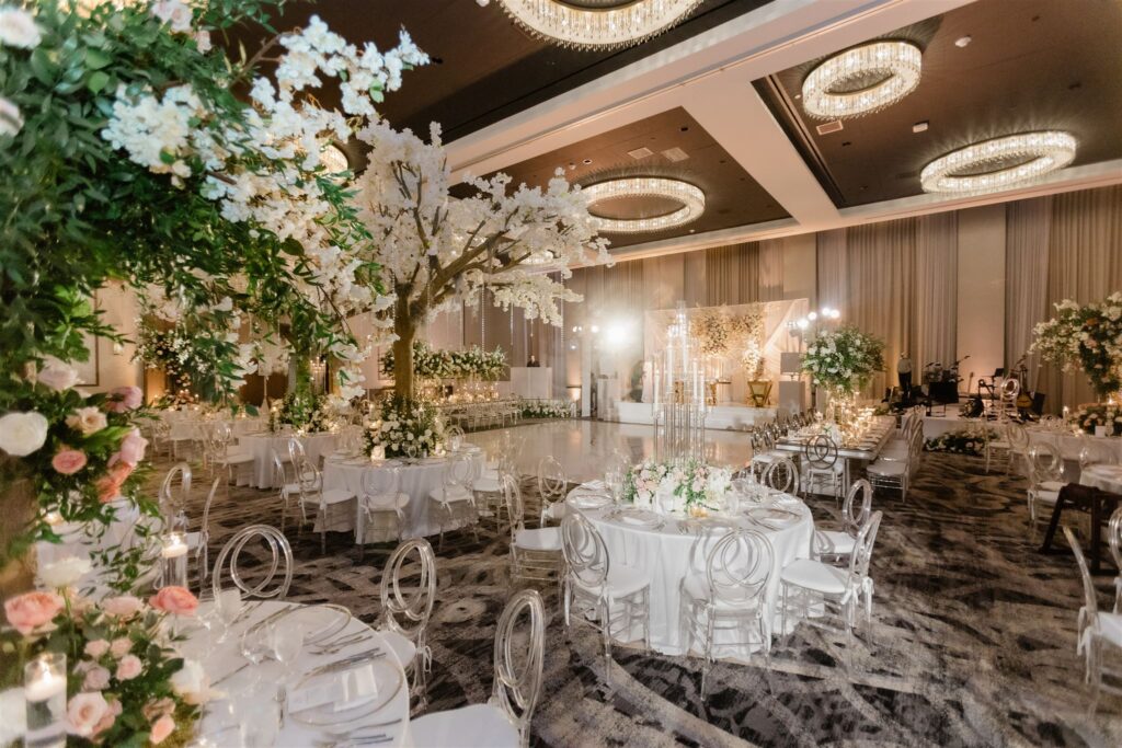 Reception room decor and florals by Petal Productions at the Loews Coral Gables wedding photographed by Angelika Krug Photo & Film a South Florida wedding photographer.