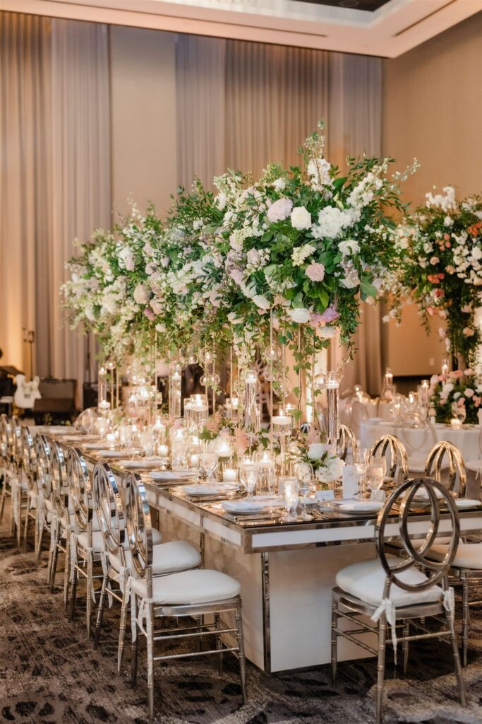 Reception room decor and florals by Petal Productions at the Loews Coral Gables wedding photographed by Angelika Krug Photo & Film a South Florida wedding photographer.