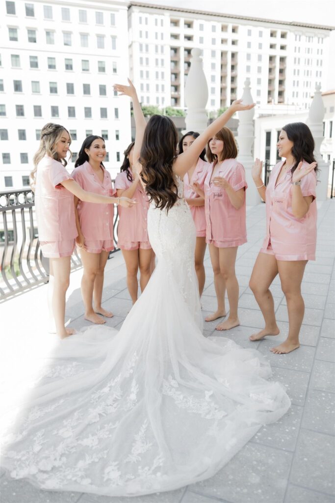 Getting ready portrait with bridesmaids at the Loews Coral Gables photographed by Angelika Krug Photo & Film a South Florida wedding photographer.