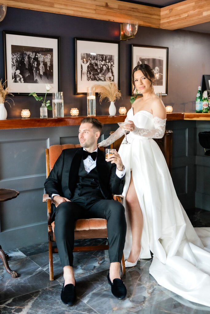 Indoor portrait of a couple at the speakeasy on their wedding day Victoria 1883 venue by Florida wedding photographer Angelika Krug Photo & Film.