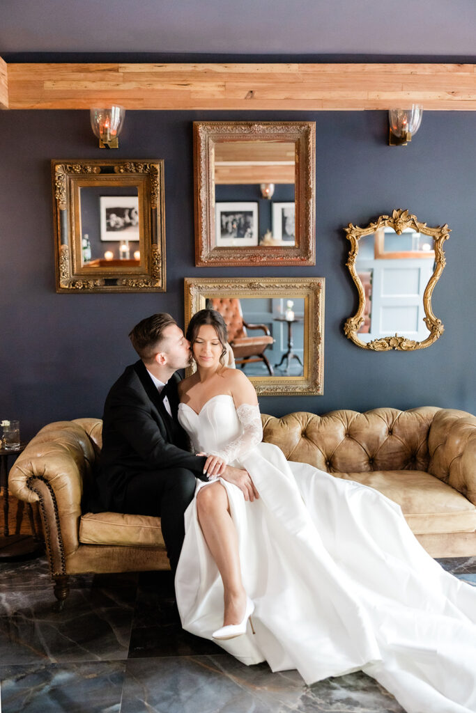 Indoor portrait of a couple at the speakeasy on their wedding day Victoria 1883 venue by Florida wedding photographer Angelika Krug Photo & Film.